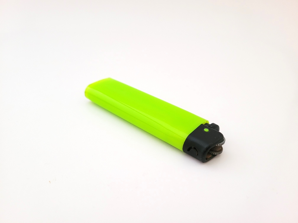 Cigarette,Lighter,That,Is,Shiny,Neon,Green,In,Color